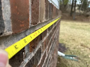 Tape measure along exterior of home